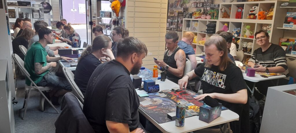 Another picture of players battling 1-on1 in round one of the Yu-Gi-Oh OTS tournament at Guild of Games, on 01/08/2024