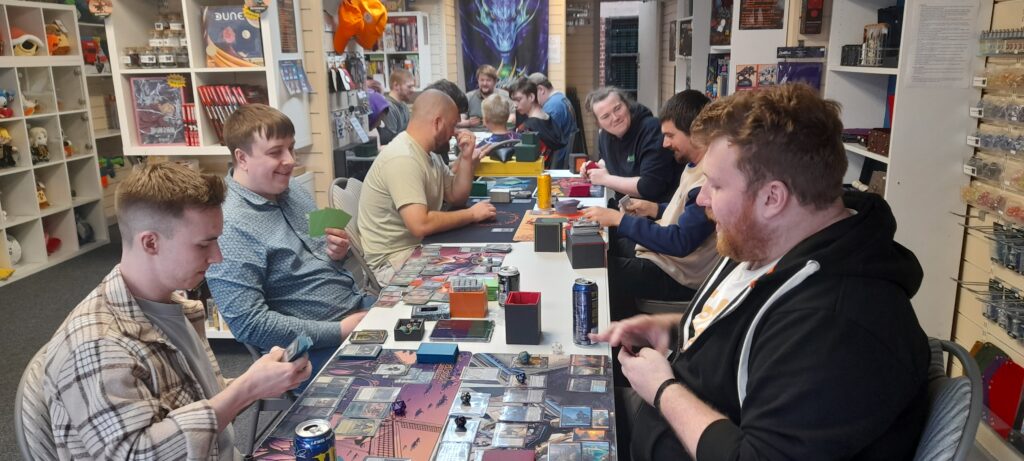 Group of players playing Magic the Gathering card game