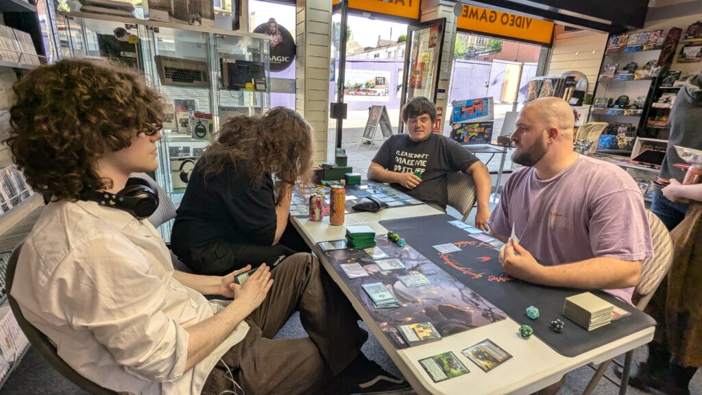 Joe, Chris and Max battling it out in Magic: The Gathering trading cards game.