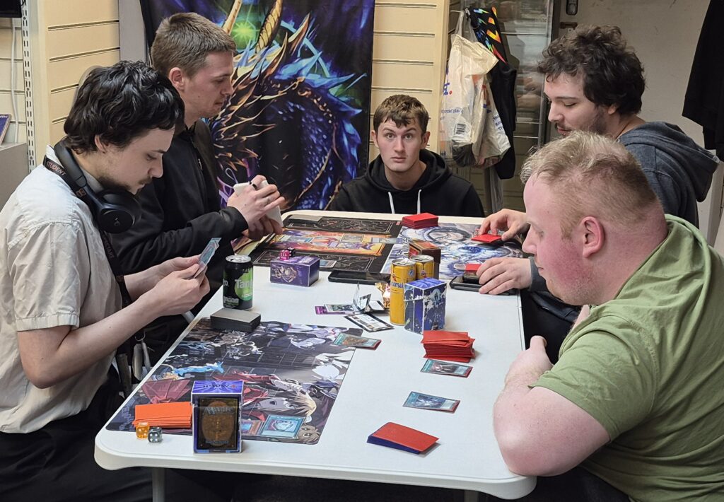 Four of the  15 players duelling during the Yu-Gi-Oh OTS tournament at teh Guild of Games on the evening of Thu 27/02/2025